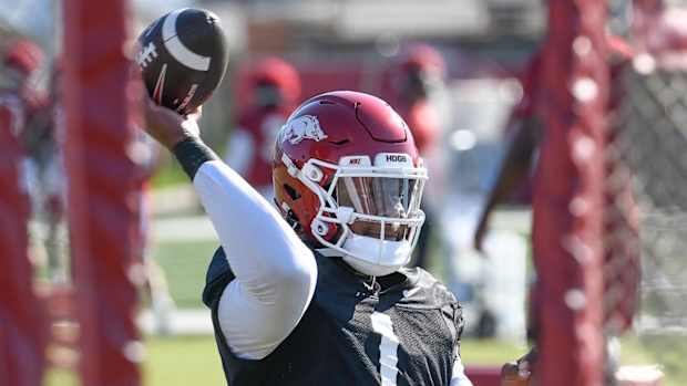Razorbacks quarterback KJ Jefferson throwing during drills in Wednesday morning's practice